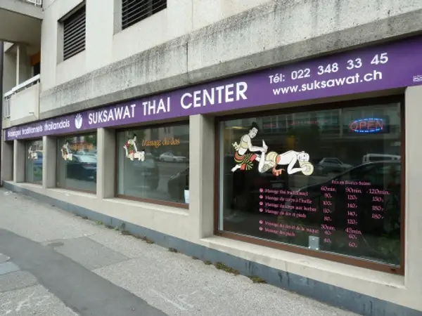 Exterior of Suksawat Thai Center with purple awning and storefront windows