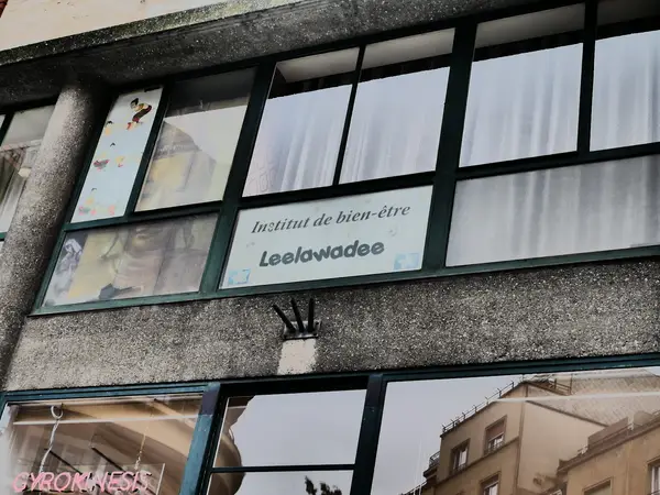 Exterior of a massage salon with large windows and Leelawadee sign